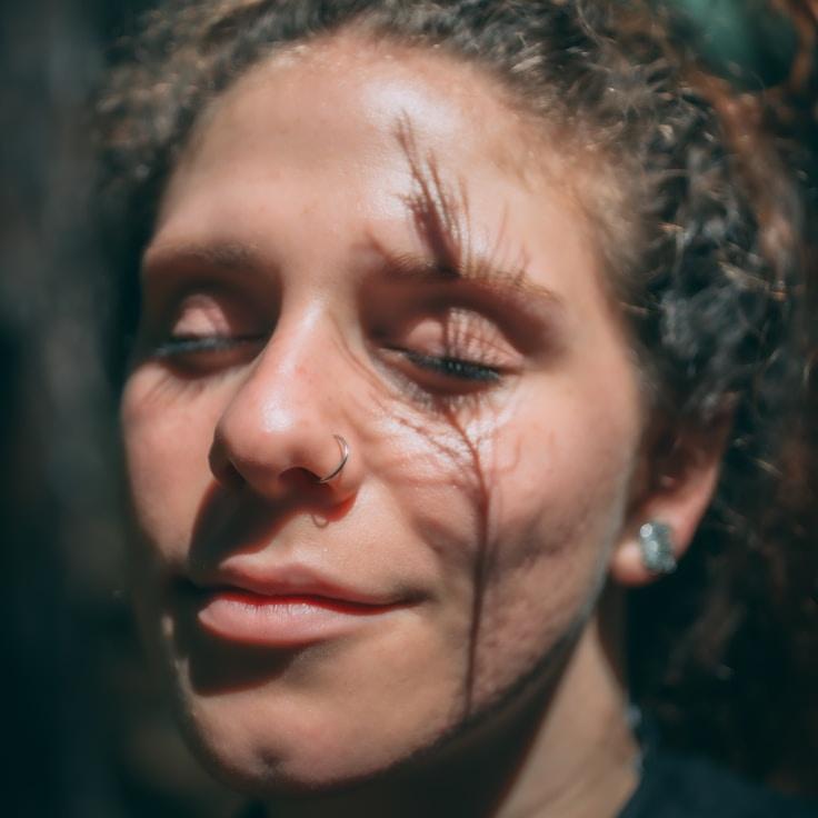 New name 1, Lead Design Curator at Soft Sage Trace, reviewing corporate floral arrangements